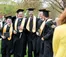 A picture of five male graduates