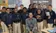 A group of kids pose for a picture with their teacher