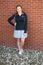 A picture of a women in a Dordt Business Club Jacket