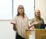 A woman talks to a classroom