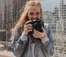 A picture of a student holding a camera