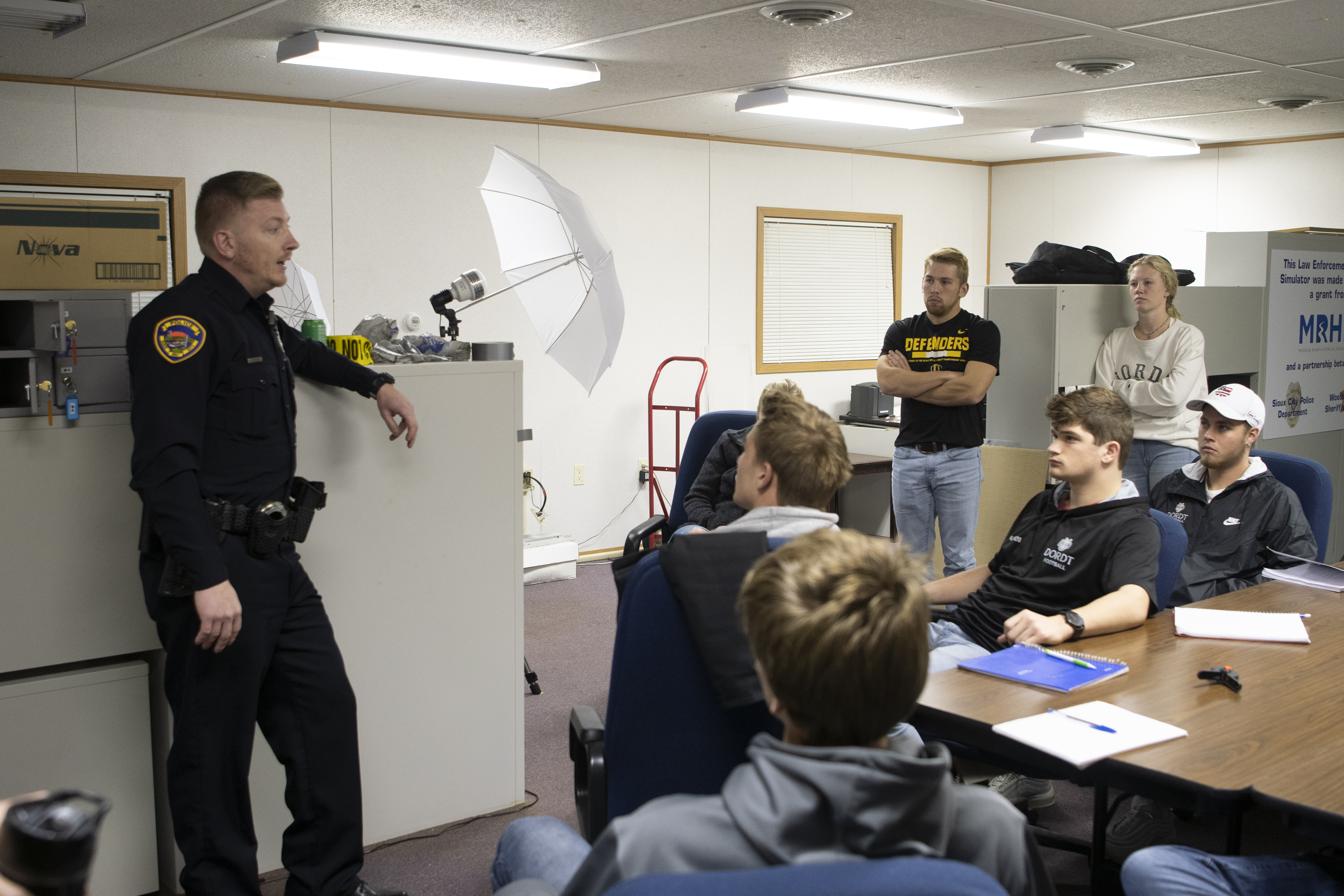 Students interact with a police officer