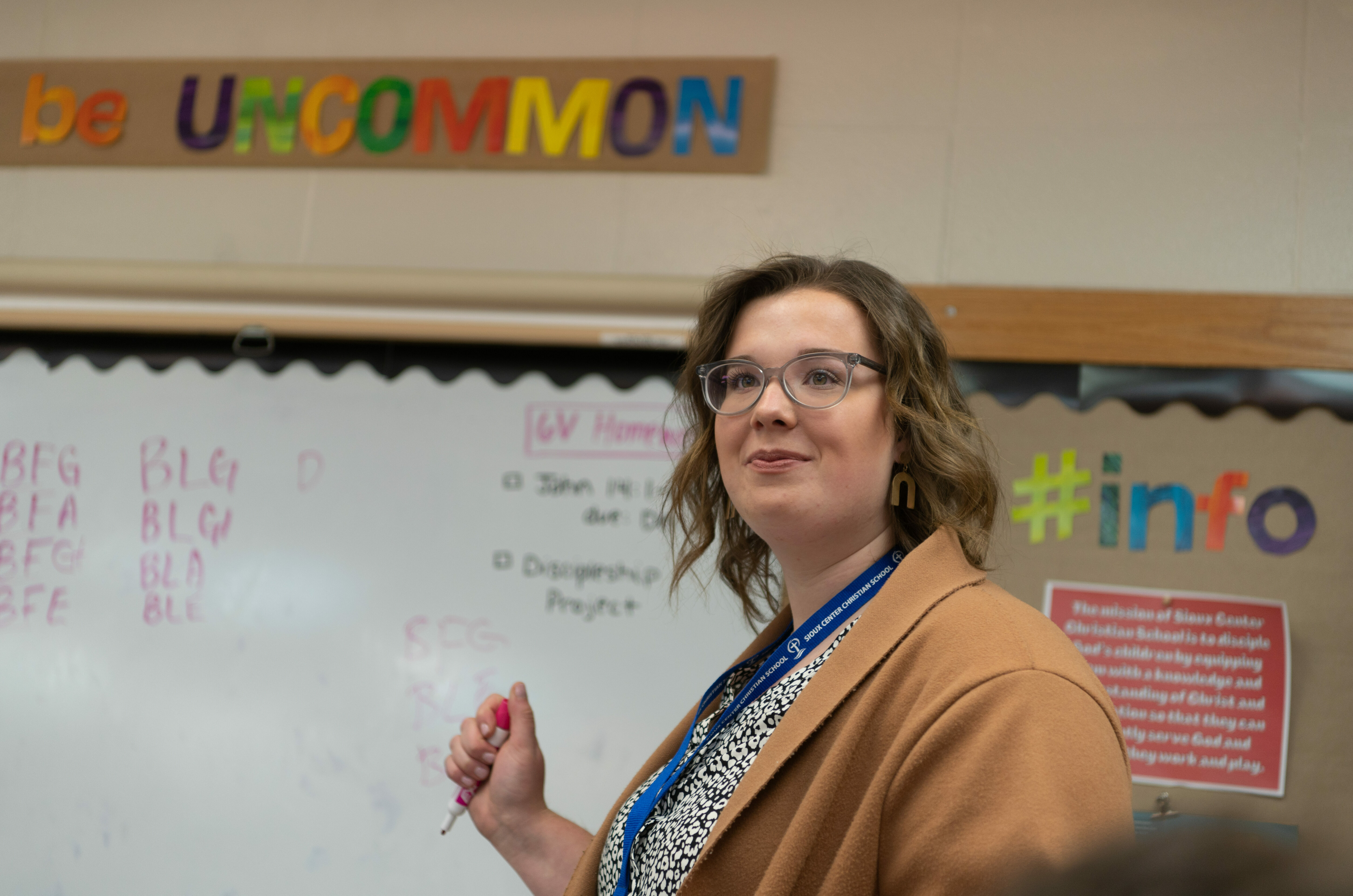 A student teacher stands at the front of class