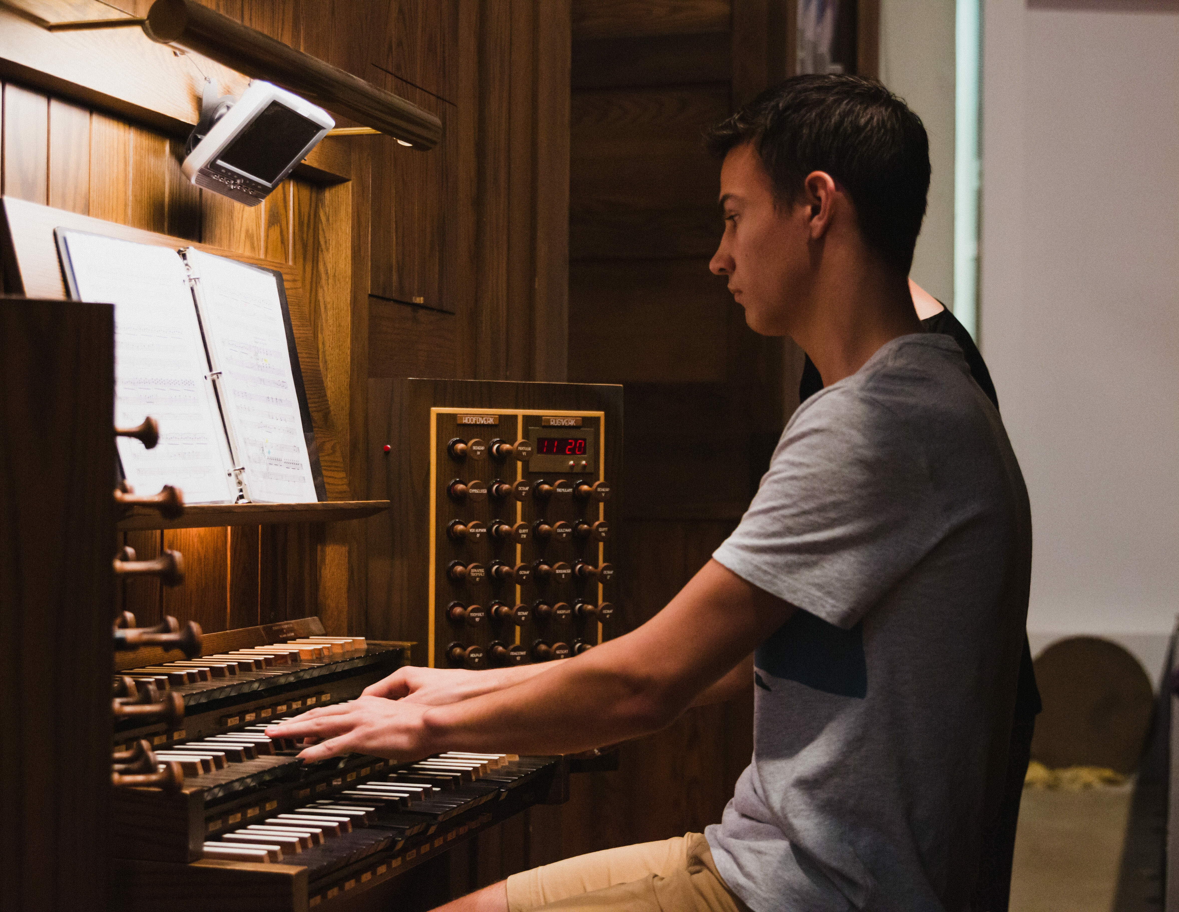 Male organist having an organ lesson