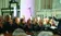 A picture of a choir singing in an old building