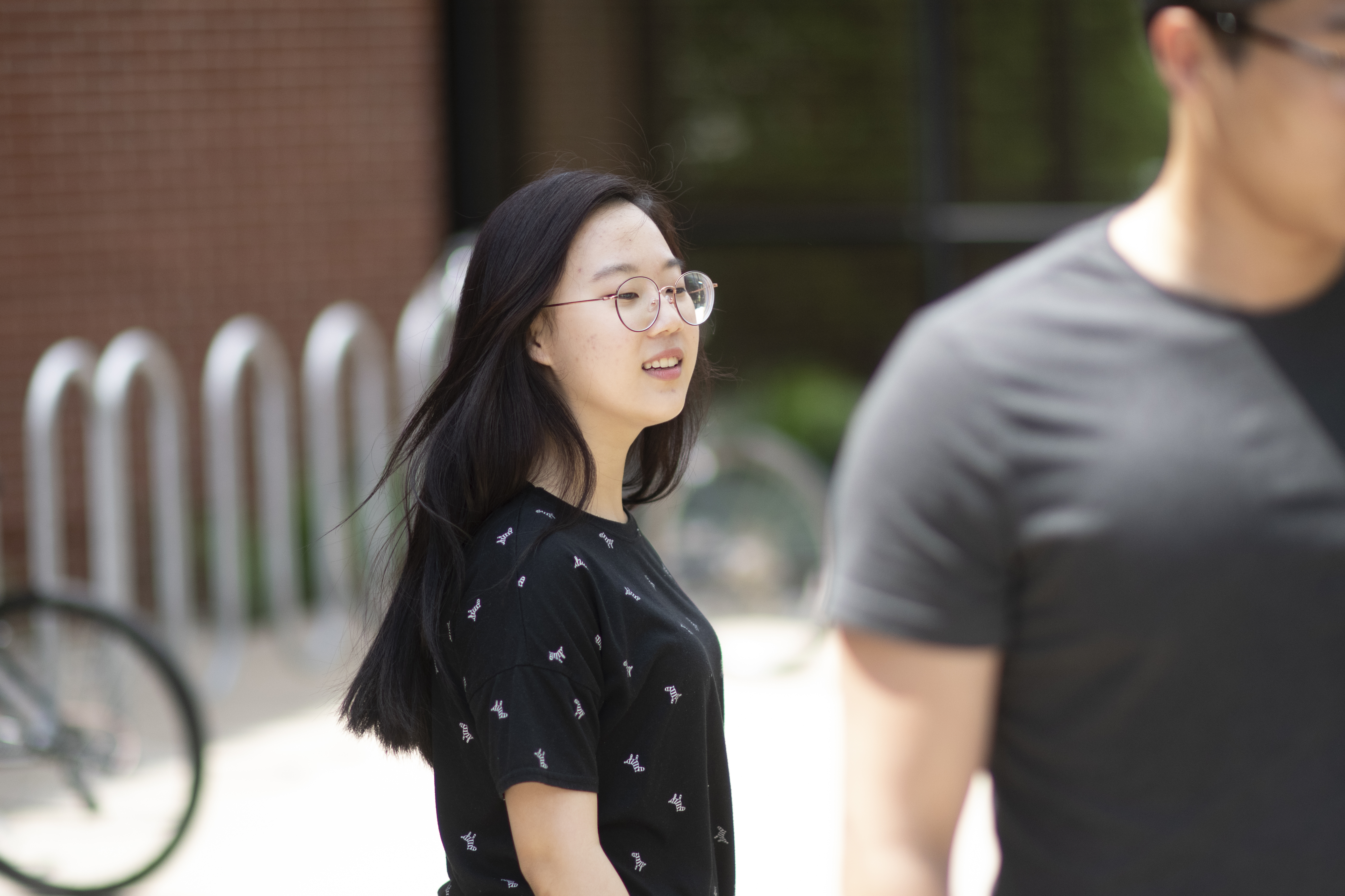 A picture of a student with black hair and glasses