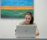 A woman works on her laptop