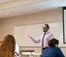 A picture of a professor teaching a class