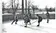 A group of students play ice hockey