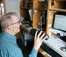 A picture of a man in a radio broadcasting booth