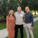 Young couple with student recipient pose and smile outside