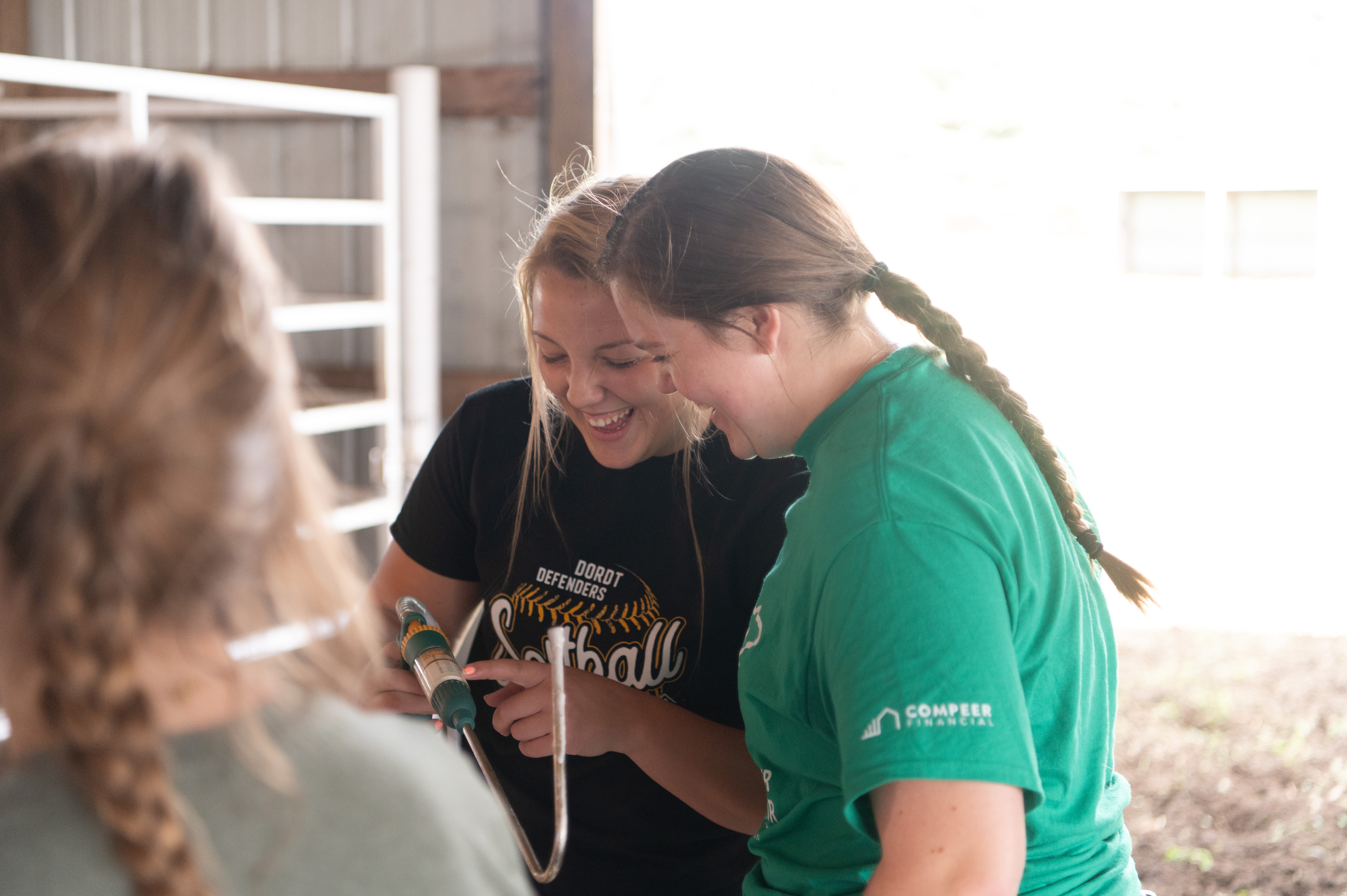 Female students laughing while working