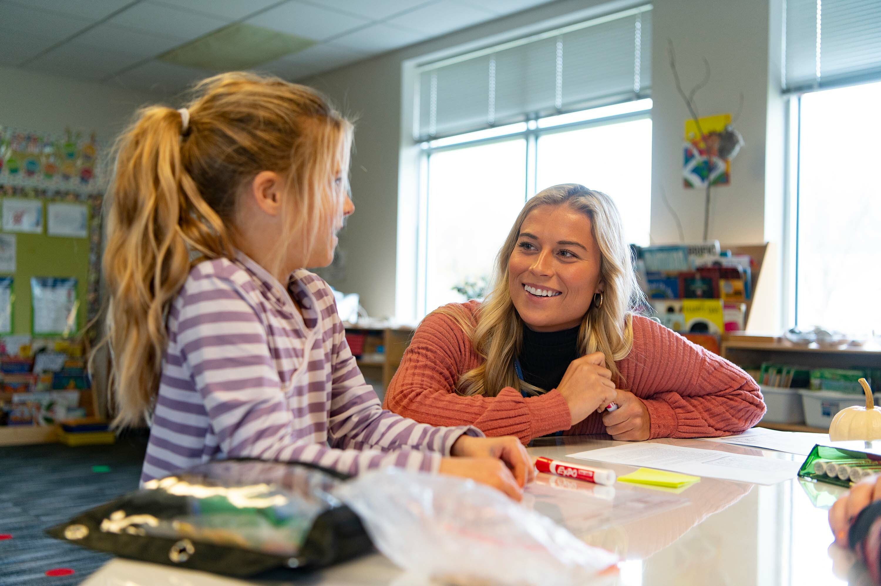 A Dordt student works with a student in class at a local elementary school