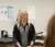 Athletic trainer speaks with people in the training room