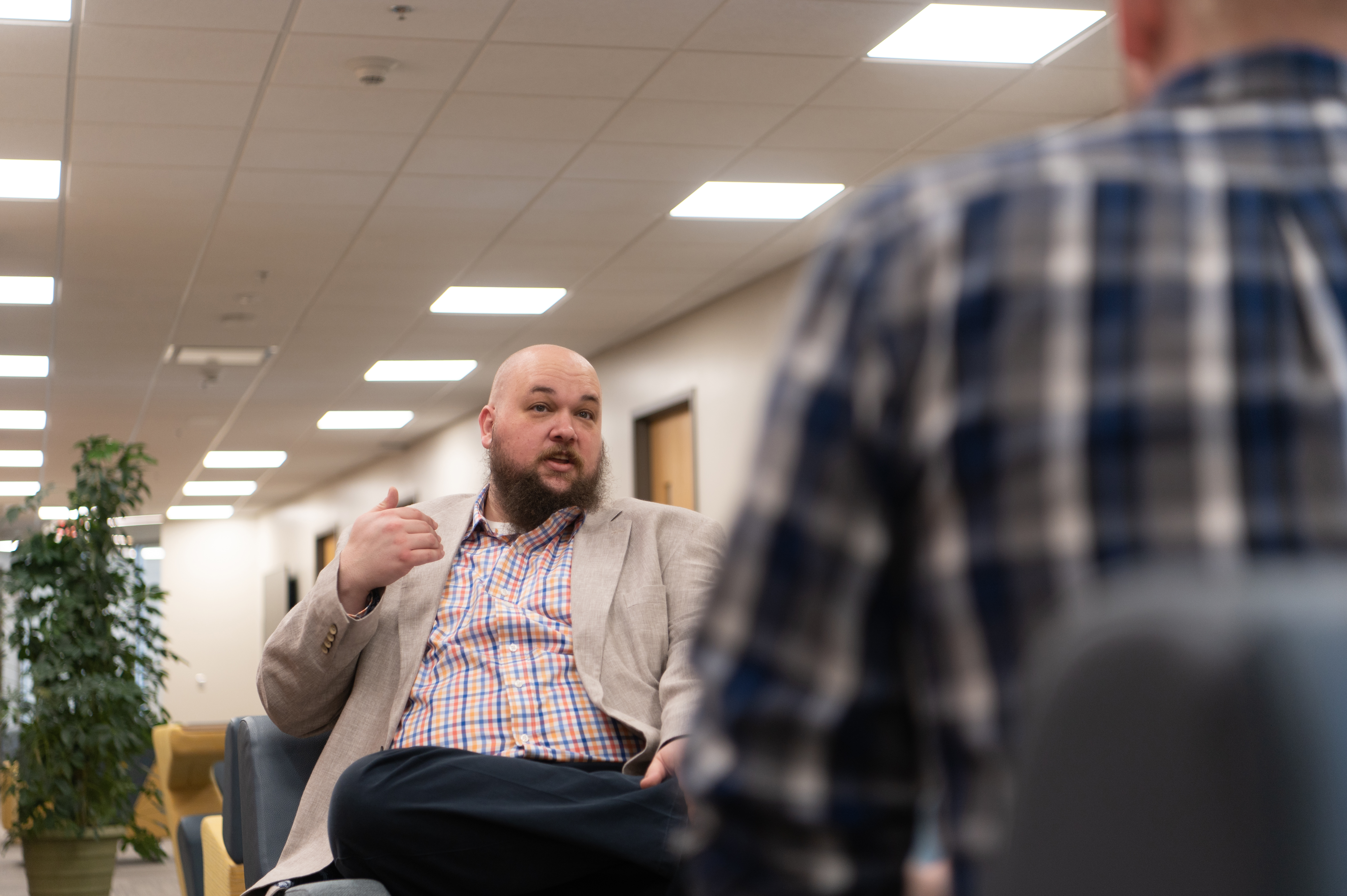 A professor talks to a student