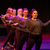 six female dancers line up while dancing during performance