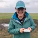 Chloe Hansum holding Vernal pool fairy shrimp, an endangered freshwater shrimp species. Photo taken under Fish and Wildlife Service Permit TE799570-6.