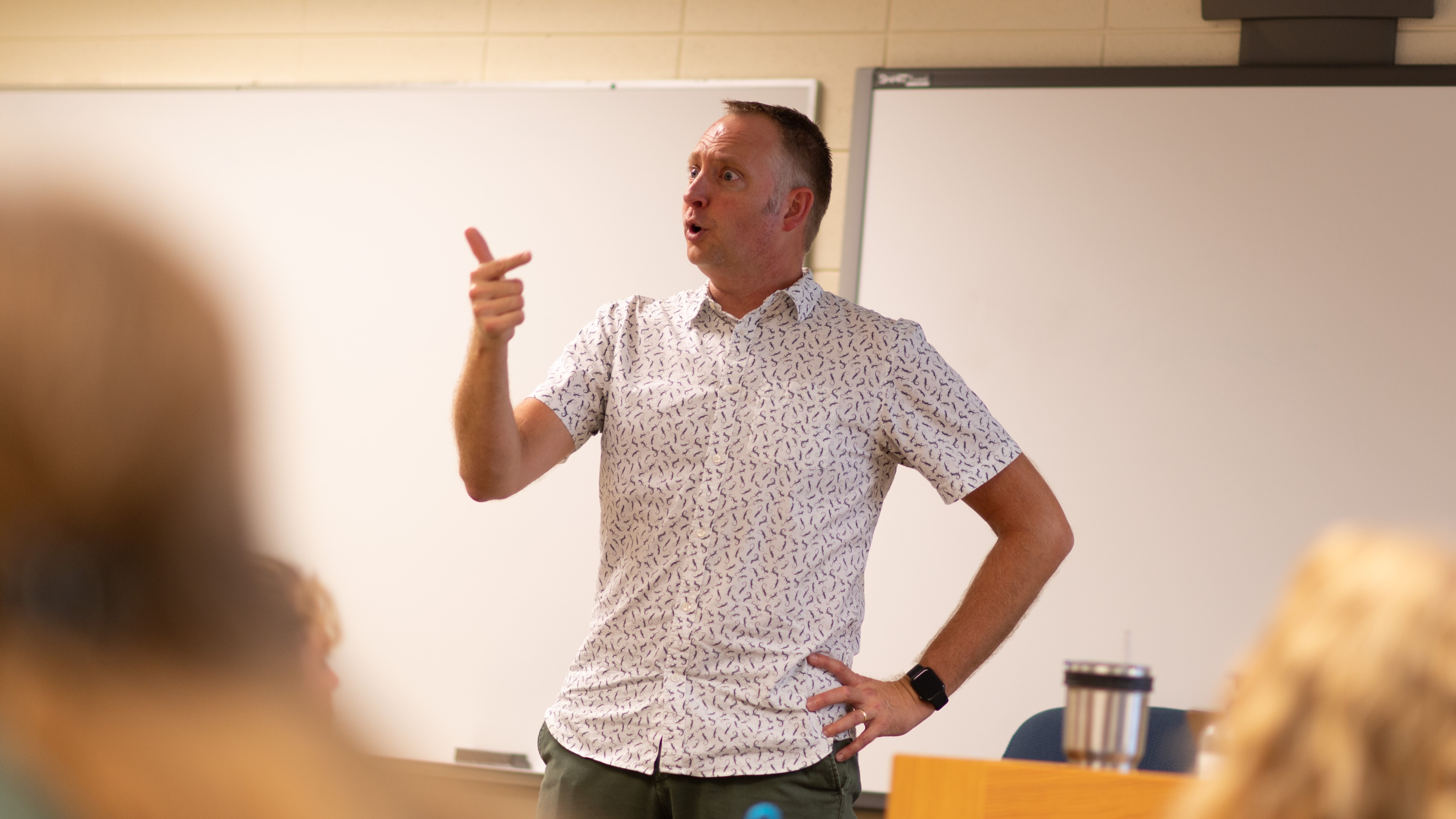 Male professor teaches in class