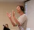 Female professor claps with her hands
