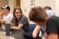 Female student shares information with her group