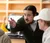 Male professor helping students