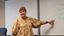 Female professor points to the white board