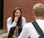 Female student smiles at a table discussion