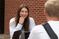 Female student smiles at a table discussion