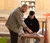 Male professor helping student draw