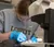 Female student dissecting an egg