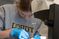 Female student dissecting an egg