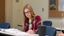 Female student writes on papers