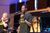 Male student singing on stage