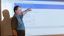 Male professor pointing to the screen