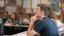 Male student sits at his desk