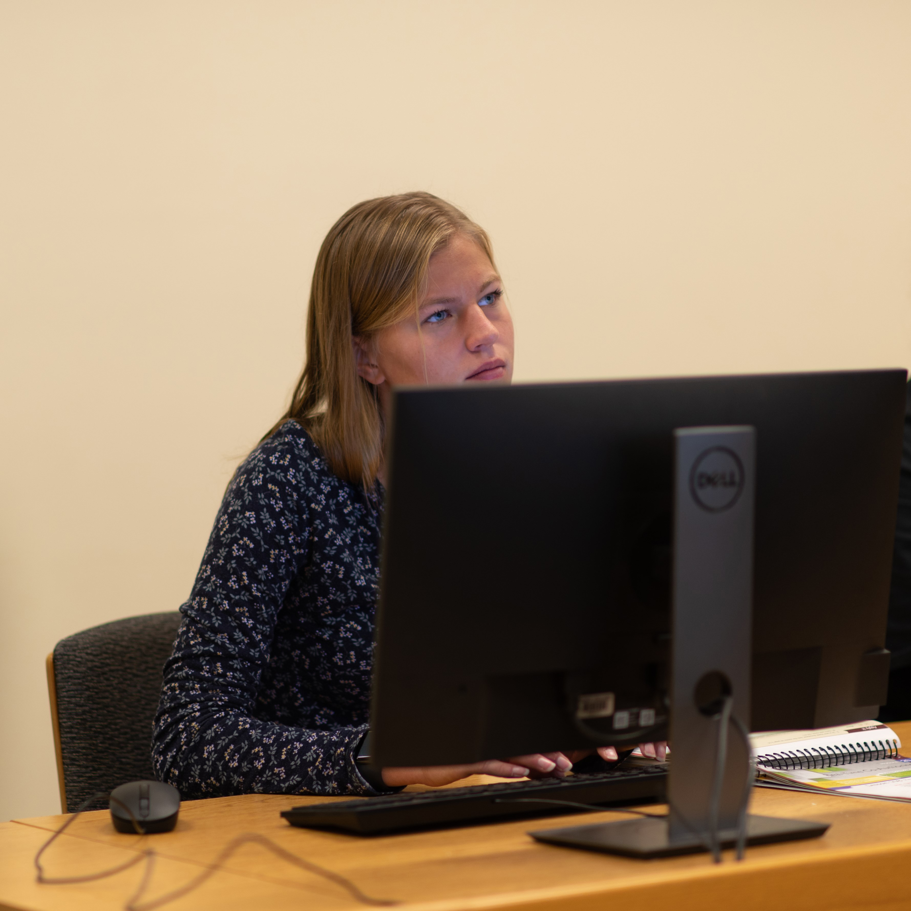 Female student sitting at computer