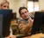 Male student assist the female on her computer