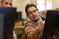 Male student assist the female on her computer