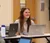 Female student looks up from her computer