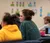 Female student engages with her class