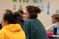 Female student engages with her class