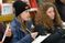 Female student uses a clipboard while learning