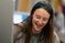 Female student smiles while she creates