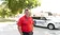 Aaron Van Beek stands in front of the Midwest Honor Flight vehicle.