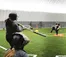 Softball players practice in the dome.