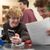 Student shares his calculator with other student