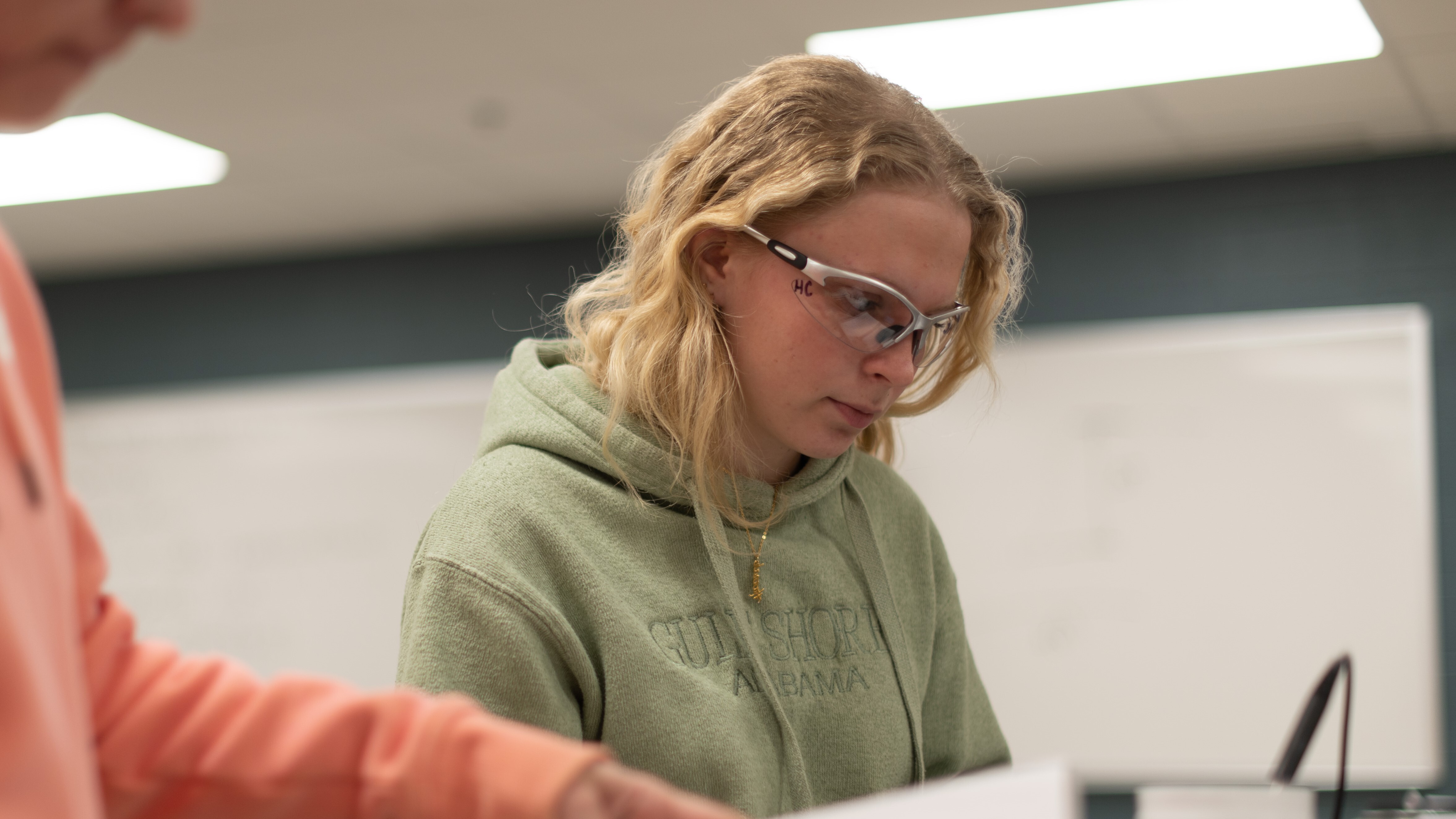 Female student with safety goggles on