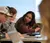 Female student looking over at her classmate