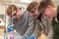 Male students looking at an experiment