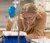 female student measuring something closely
